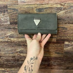 Tri-fold grey wallet with triangle stone-wearing on the edges